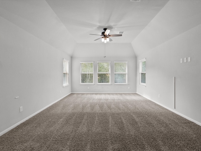 unfurnished room with carpet flooring, ceiling fan, and lofted ceiling