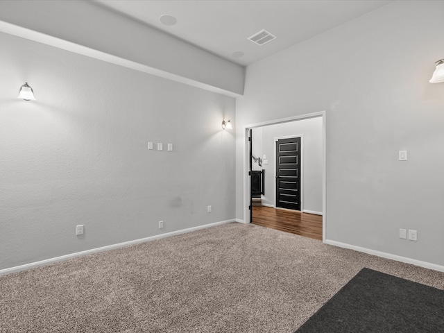 empty room with dark carpet