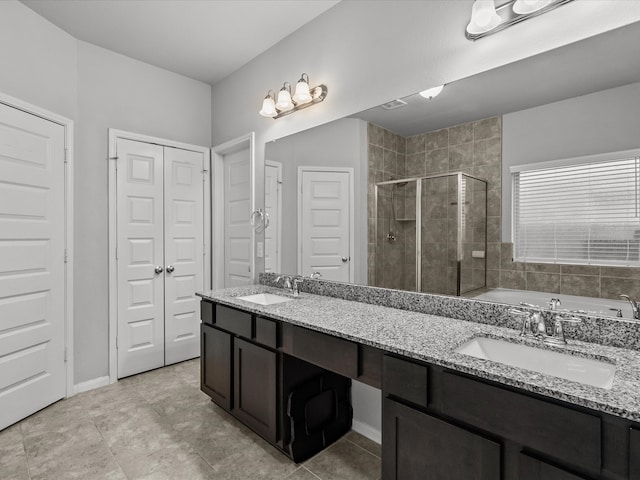 bathroom featuring vanity and an enclosed shower