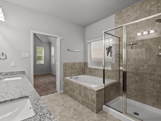 bathroom with vanity, tile patterned floors, and independent shower and bath