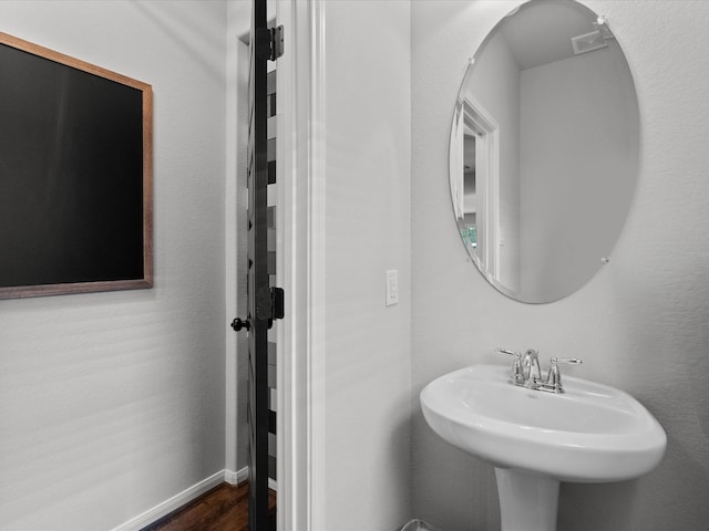 bathroom featuring hardwood / wood-style floors and sink