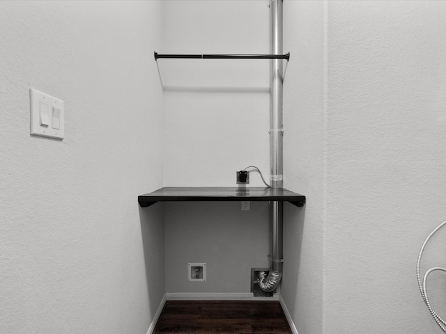 clothes washing area with hookup for an electric dryer, hookup for a washing machine, and dark wood-type flooring