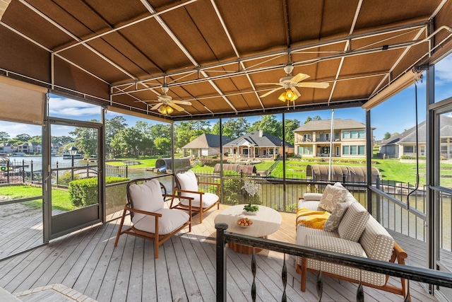 sunroom with a water view and wood ceiling