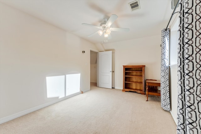 unfurnished bedroom with ceiling fan and light colored carpet