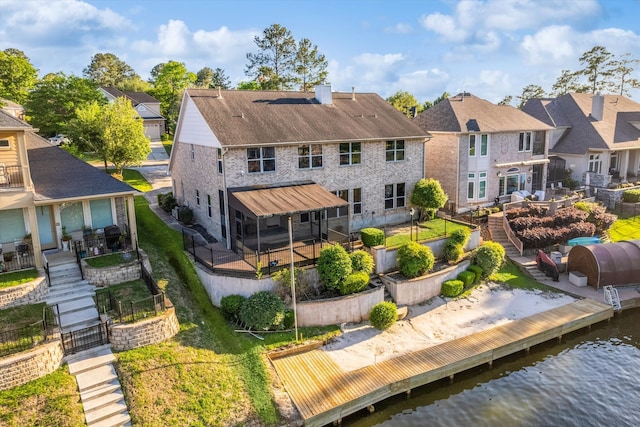 back of house featuring a water view