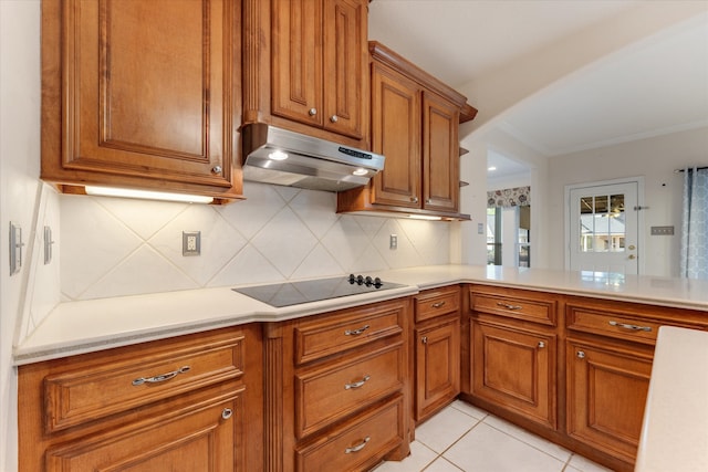 kitchen featuring kitchen peninsula, decorative backsplash, black electric cooktop, and light tile patterned flooring