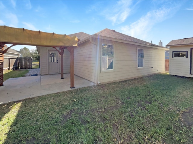 view of home's exterior with a pergola, a patio area, and a yard