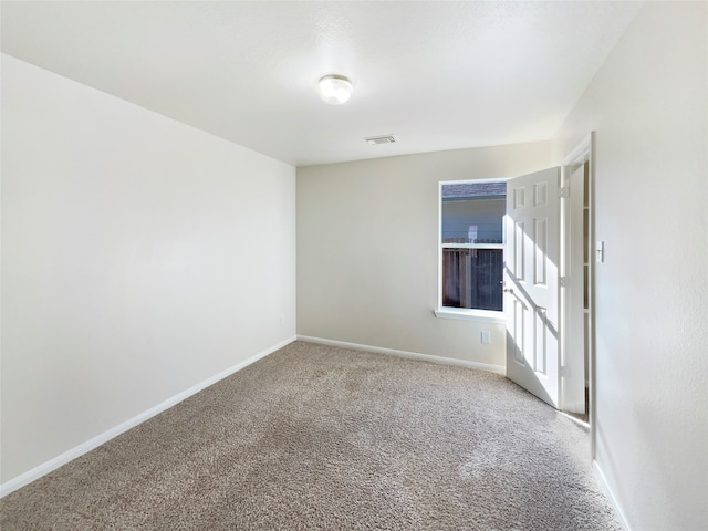 unfurnished room with carpet flooring