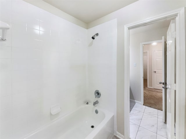 bathroom featuring tiled shower / bath combo