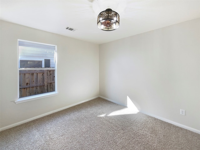 unfurnished room featuring carpet