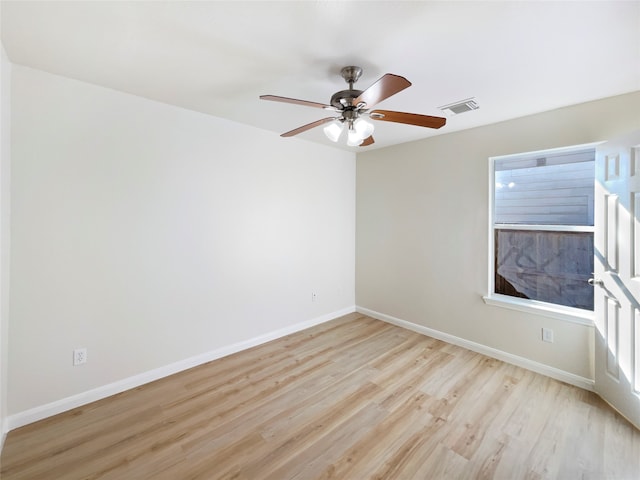 spare room with ceiling fan and light hardwood / wood-style flooring