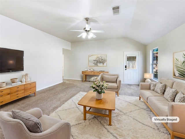 carpeted living room featuring vaulted ceiling and ceiling fan