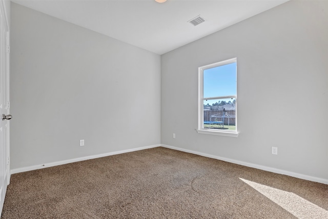 spare room featuring carpet floors