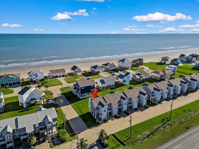 aerial view featuring a water view and a view of the beach