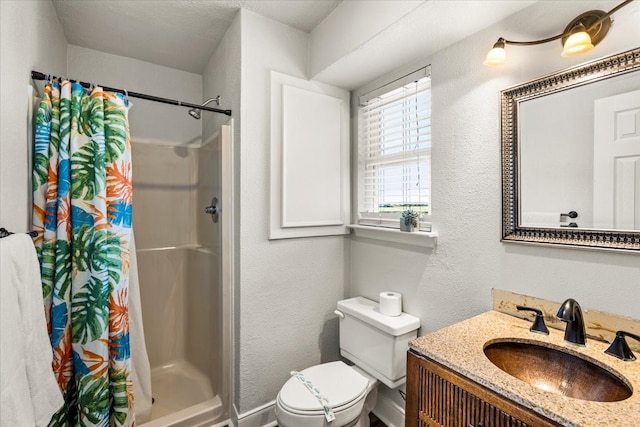 bathroom featuring a textured ceiling, vanity, toilet, and walk in shower