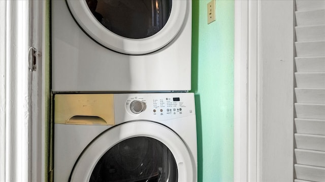 laundry area with stacked washer / drying machine