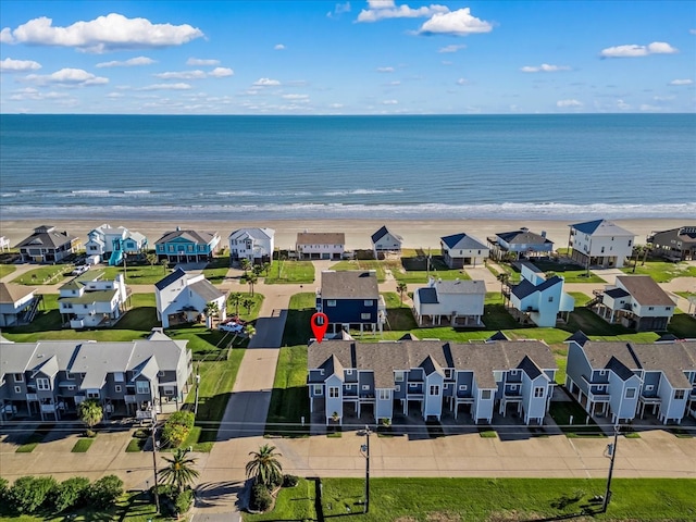 aerial view featuring a water view and a beach view