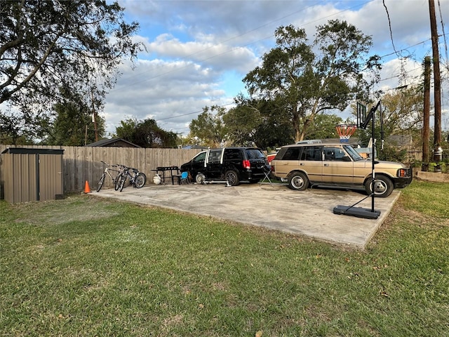 view of vehicle parking with a yard