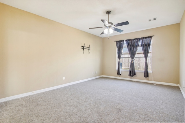 empty room with carpet flooring and ceiling fan