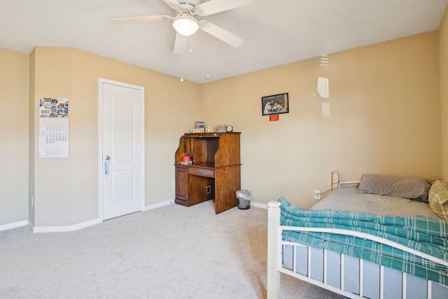 bedroom featuring ceiling fan and light carpet