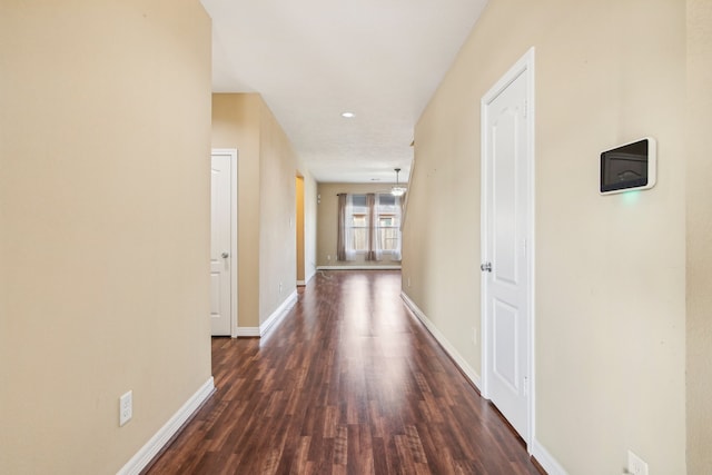 corridor with dark wood-type flooring