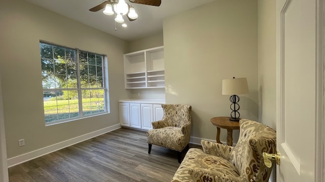 living area with hardwood / wood-style flooring and ceiling fan