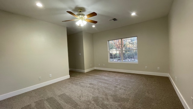 carpeted empty room featuring ceiling fan