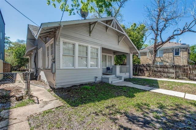 bungalow featuring a front yard and a porch