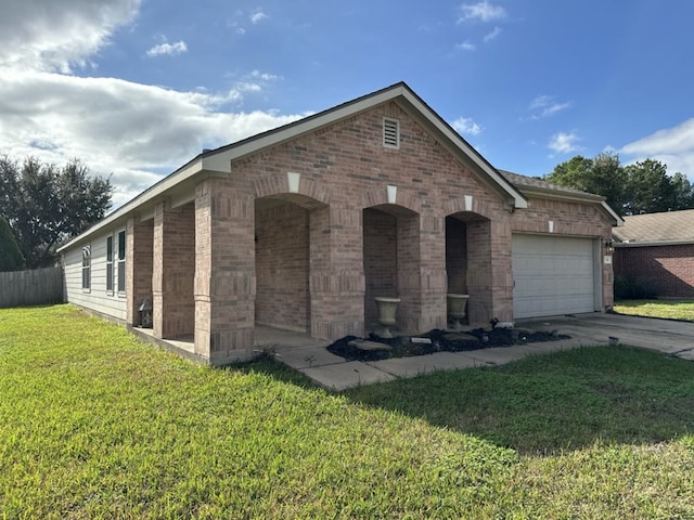 single story home featuring a garage and a front lawn