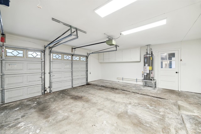 garage with gas water heater and a garage door opener