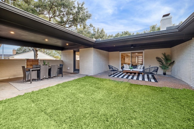 view of yard featuring outdoor lounge area and a patio