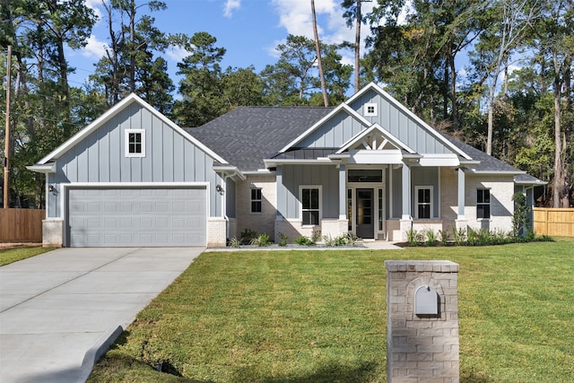 view of front facade with a front yard and a garage