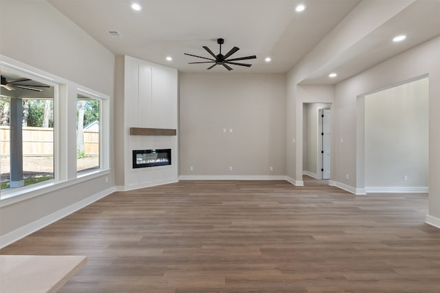 unfurnished living room featuring a fireplace and light wood-type flooring