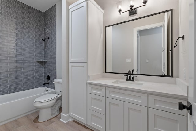 full bath with shower / bathing tub combination, vanity, toilet, and wood finished floors