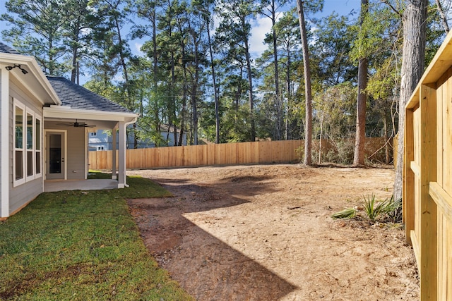 view of yard featuring a patio and ceiling fan