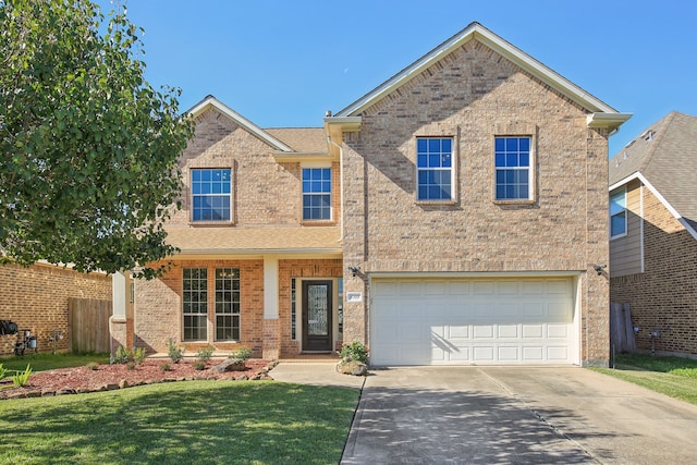 view of front of house with a front lawn and a garage