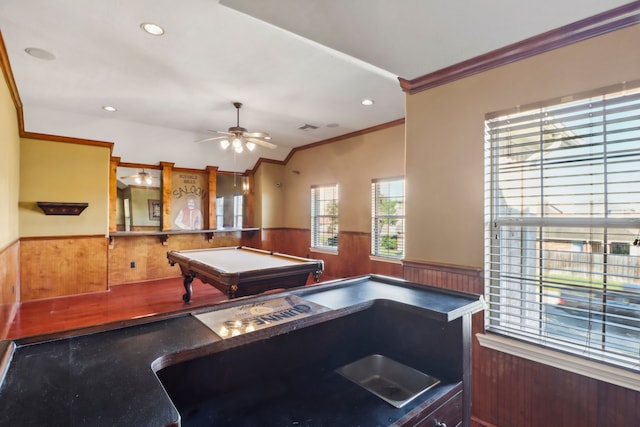 game room with wood walls, crown molding, billiards, ceiling fan, and wood-type flooring