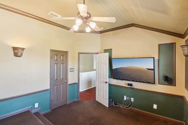 interior space with ceiling fan, lofted ceiling, and crown molding