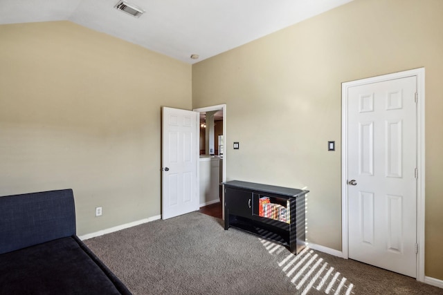 carpeted bedroom featuring lofted ceiling