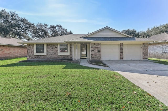 single story home with a garage and a front lawn