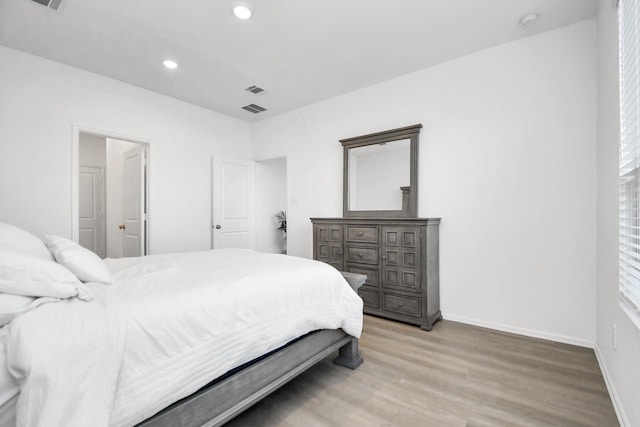 bedroom with light hardwood / wood-style floors