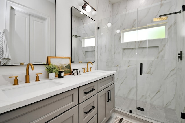 bathroom featuring vanity, walk in shower, and a wealth of natural light