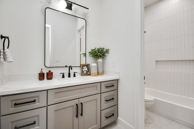 full bathroom featuring tile patterned floors, vanity, toilet, and tiled shower / bath