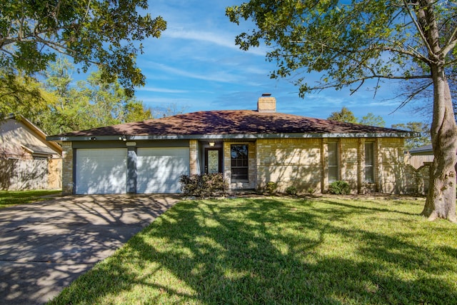 single story home with a front yard and a garage