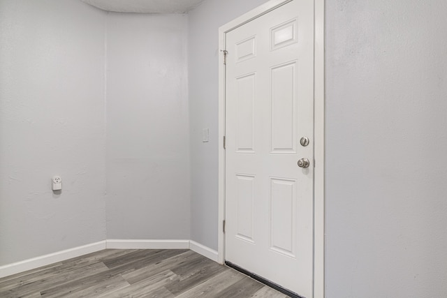 entryway with wood-type flooring