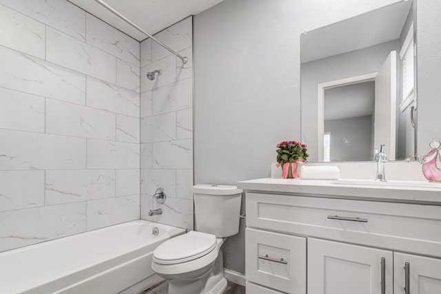 full bathroom featuring vanity, toilet, and tiled shower / bath