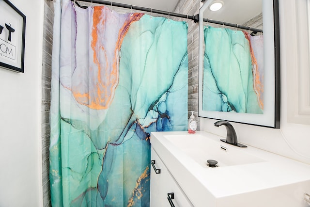 bathroom with vanity and walk in shower