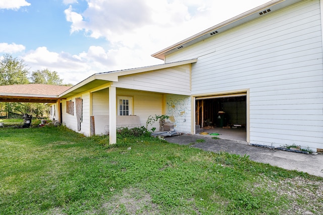 view of property exterior featuring a lawn