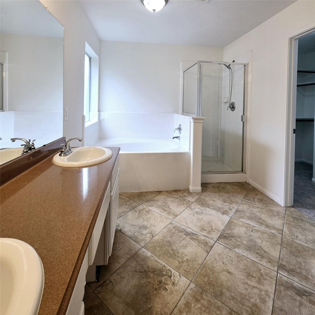 bathroom featuring vanity and separate shower and tub