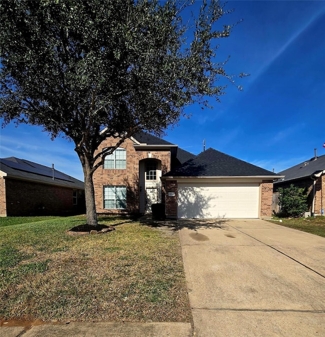 view of front facade with a garage and a front lawn